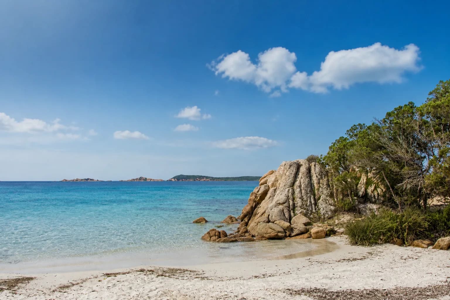 Capriccioli beach in clear late-season daylight