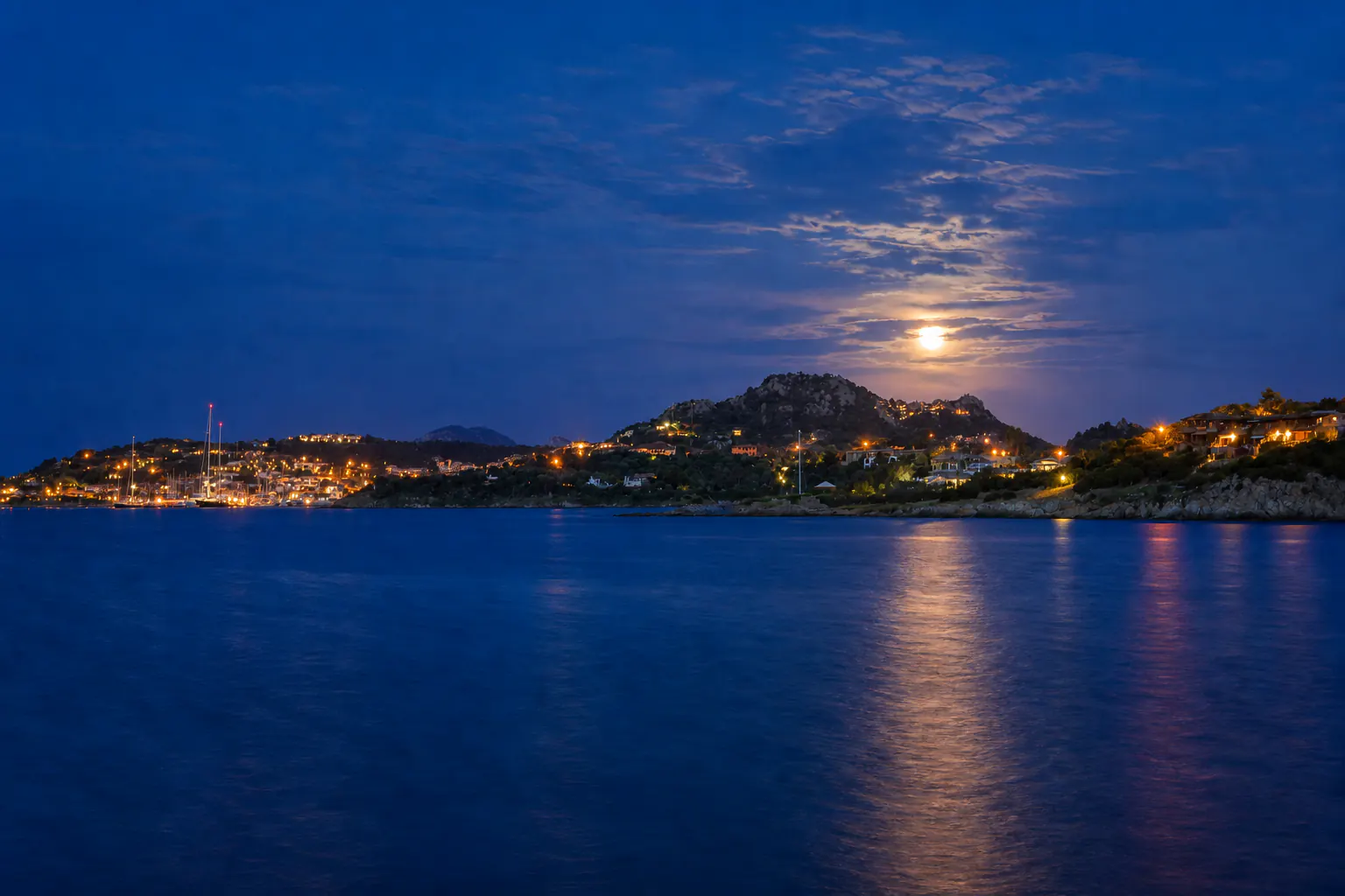 Porto Rotondo's illuminated waterfront by night